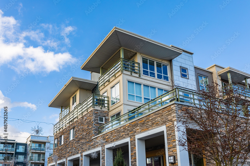 Brand new apartment building on sunny day in BC, Canada. Architectural details of modern apartment building