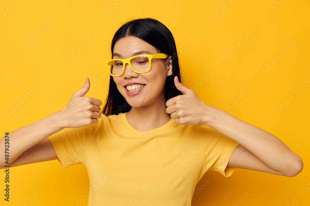 woman in yellow t-shirts with glasses posing fashion Lifestyle unaltered woman in yellow t-shirts with glasses posing fashion Lifestyle unaltered