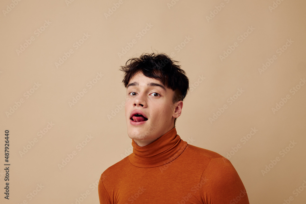 Obraz premium handsome guy posing in brown sweater self confidence fashion Lifestyle unaltered