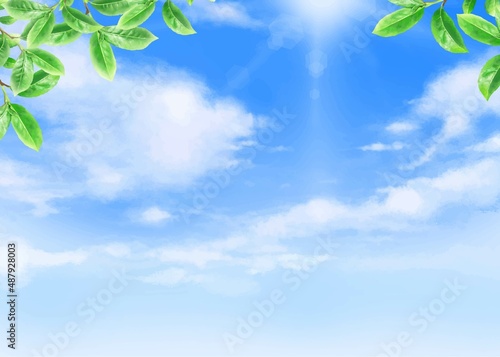 太陽の光が差し込む雲のある青空に新緑の美しい葉っぱの初夏フレーム背景素材