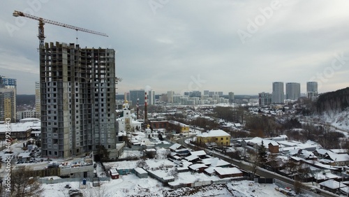 construction of a residential building, apartments, unfinished house, tower crane. Residential development. High quality photo