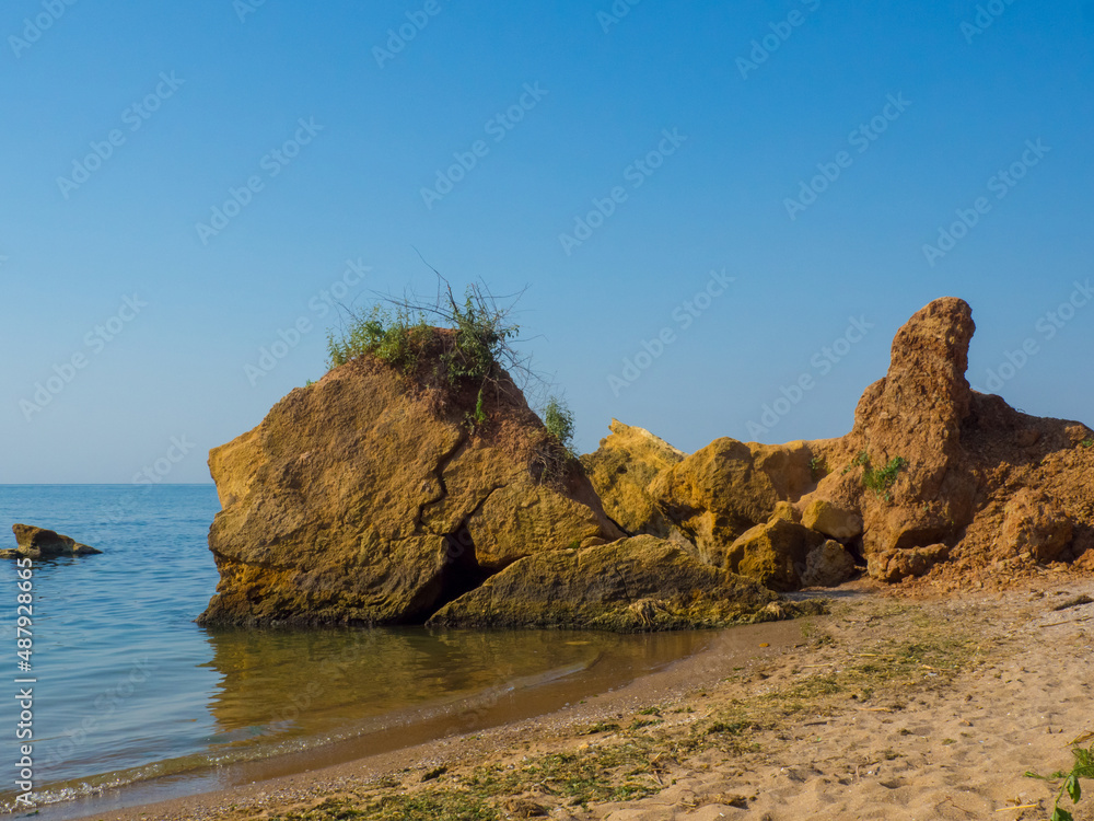 Beautiful sea at noon in summer, clear water, sand beach. silent waves are illuminated by the midday sun. seascape in Ukraine. Beautiful sea at noon in summer, clear water, sand beach. silent waves are illuminated by the midday sun. seascape in Ukraine.