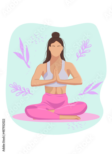 the girl is sitting in the lotus position doing yoga