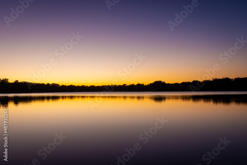 Purple and gold sunset over lake
