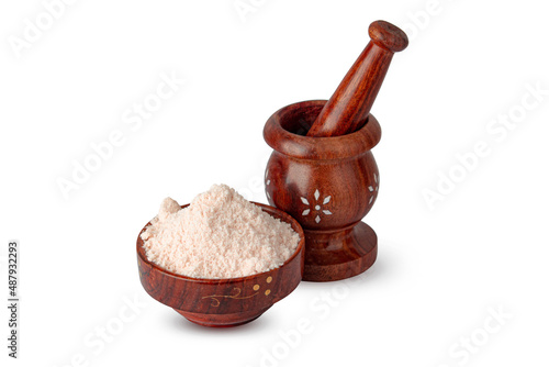Indian style wooden Mortar and pestle with himalyan salt in wooden bowl photo