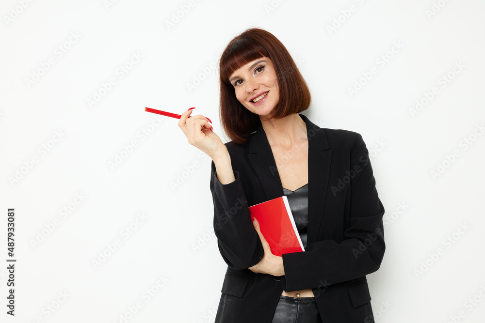 portrait of a woman in a black jacket notepad writing ideas isolated background portrait of a woman in a black jacket notepad writing ideas isolated background