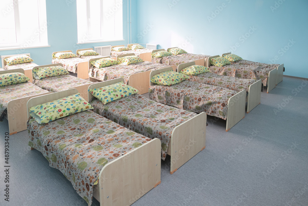 New baby beds in an empty preschool bedroom new children s beds