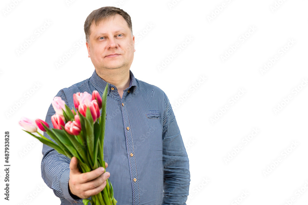 An adult male blonde holds bouquet of bright fragrant tulips, isolated, white background. An adult male blonde holds bouquet of bright fragrant tulips, isolated, white background.