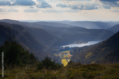 Fototapeta Naklejka Na Ścianę i Meble -  Mountain landscape during autumn fall with lake and forest at Balveurches peak in the Massif des Vosges France