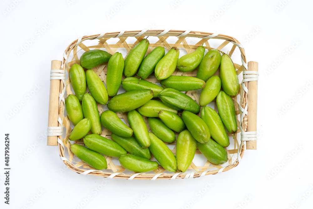 Bilimbi fruit in bamboo basket on white background. Bilimbi fruit in bamboo basket on white background.