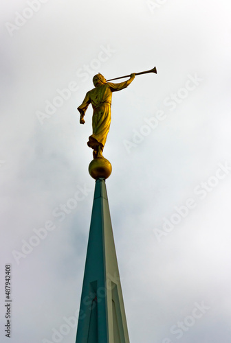 Sculpture of angel moroni atop of a Mormon Temple.	
