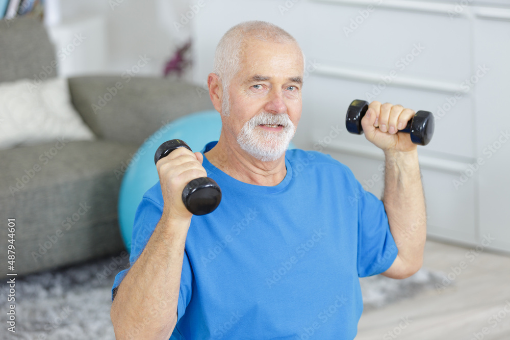 photo of a senior man doing dumbbell photo of a senior man doing dumbbell