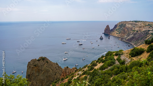 Yachts stand in a bay with azure water near Cape Fiolent