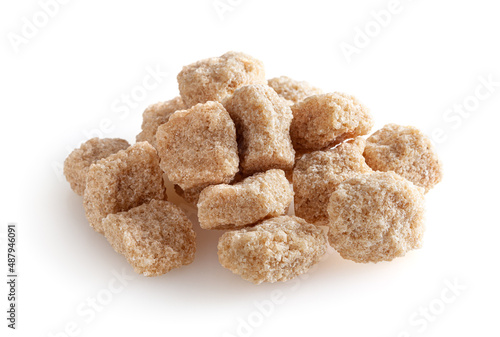 Cubes of brown cane sugar isolated on white background