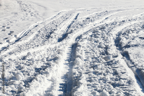 Traces of snowmobile on the snow. © agneskantaruk