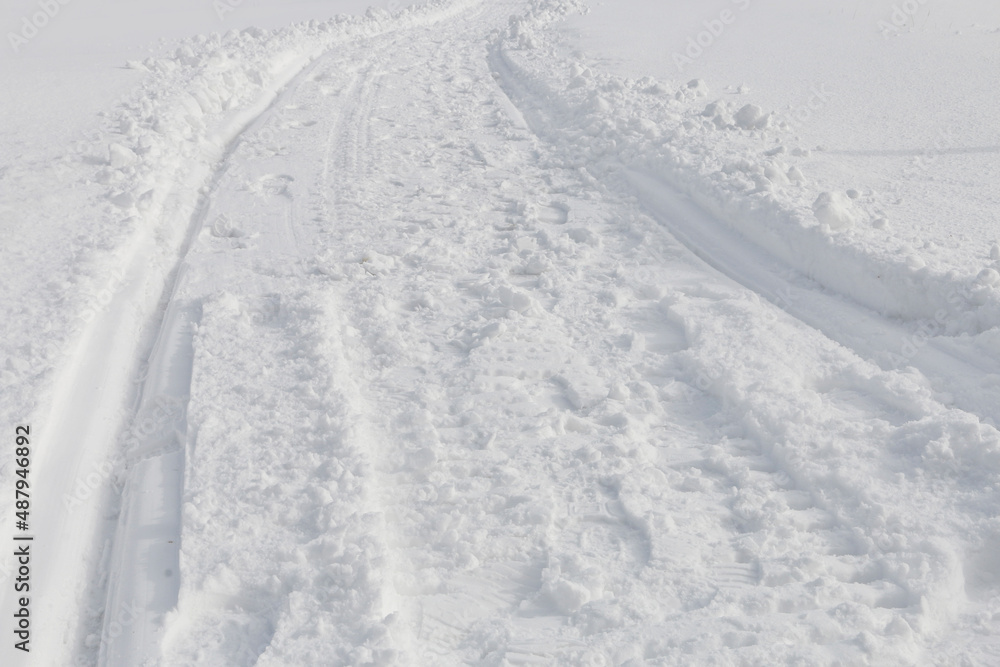 Traces of snowmobile on the snow.