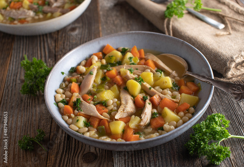 Chicken soup with vegetable, potatoes and white beans