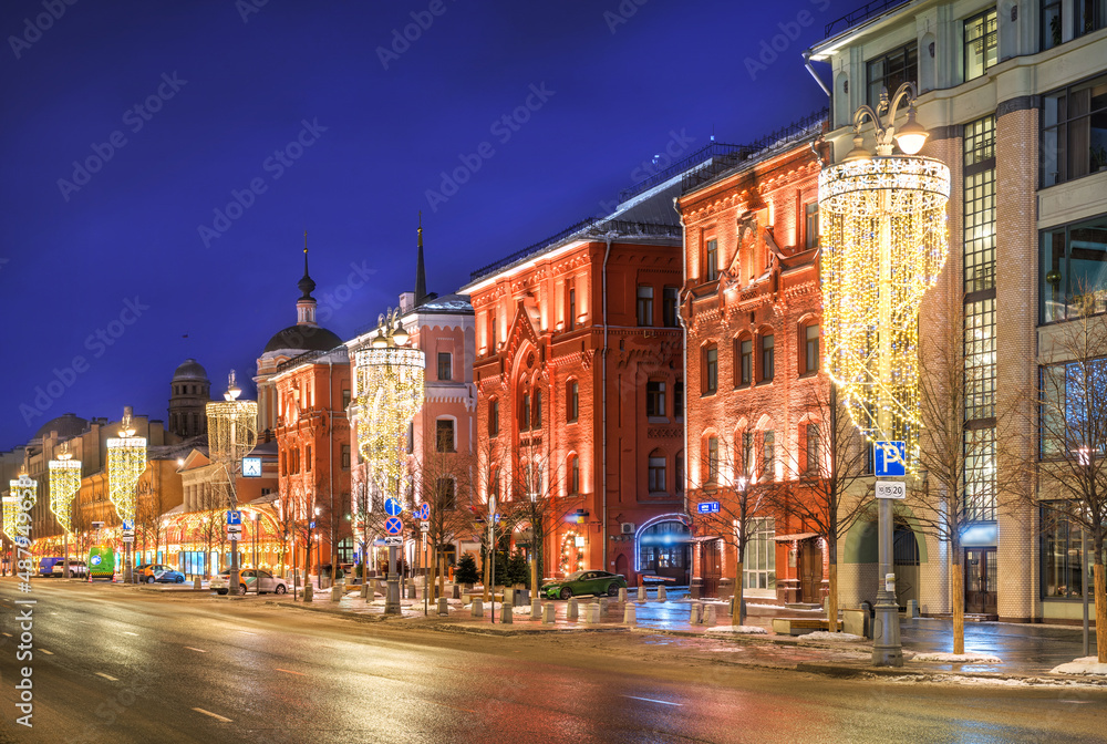 Ancient buildings and a temple on New Square in Moscow in the light of night lights