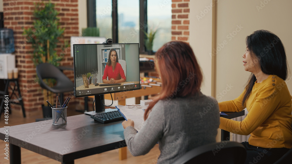 Team of asian women using video conference call for job interview online appointment with candidate. HR employees meeting with applicant on remote teleconference to hire intern. Team of asian women using video conference call for job interview online appointment with candidate. HR employees meeting with applicant on remote teleconference to hire intern.