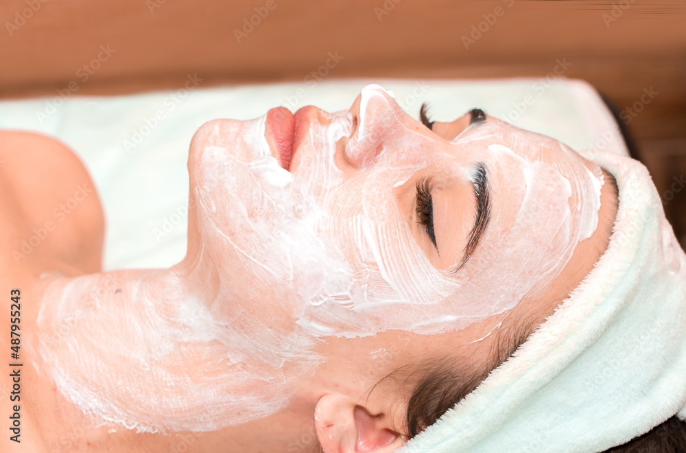 The girl at the beautician makes spa treatments, massage, facial cleansing and a mask for the skin. Cosmetic procedures in a beauty salon, facial skin care for rejuvenation. The girl at the beautician makes spa treatments, massage, facial cleansing and a mask for the skin. Cosmetic procedures in a beauty salon, facial skin care for rejuvenation.