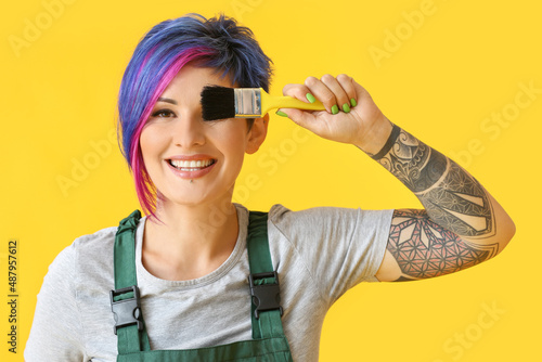 Female painter with brush o...