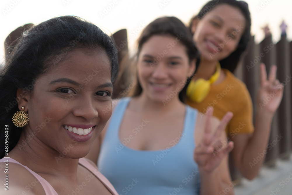 Portrait of Three women standing outdoors. Happy looking women, in the park, taking a selfie. Portrait of Three women standing outdoors. Happy looking women, in the park, taking a selfie.
