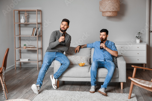 Male friends drinking beer ...