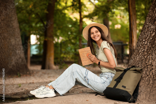 Female tourist reading book...
