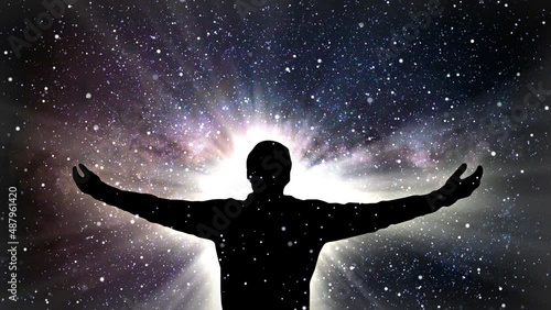 Glowing silhouette of person gazing at starry night space sky with hands spreaded wide. Nebula, stars, planets are visible. Aspiration and development concept with futuristic technology look.