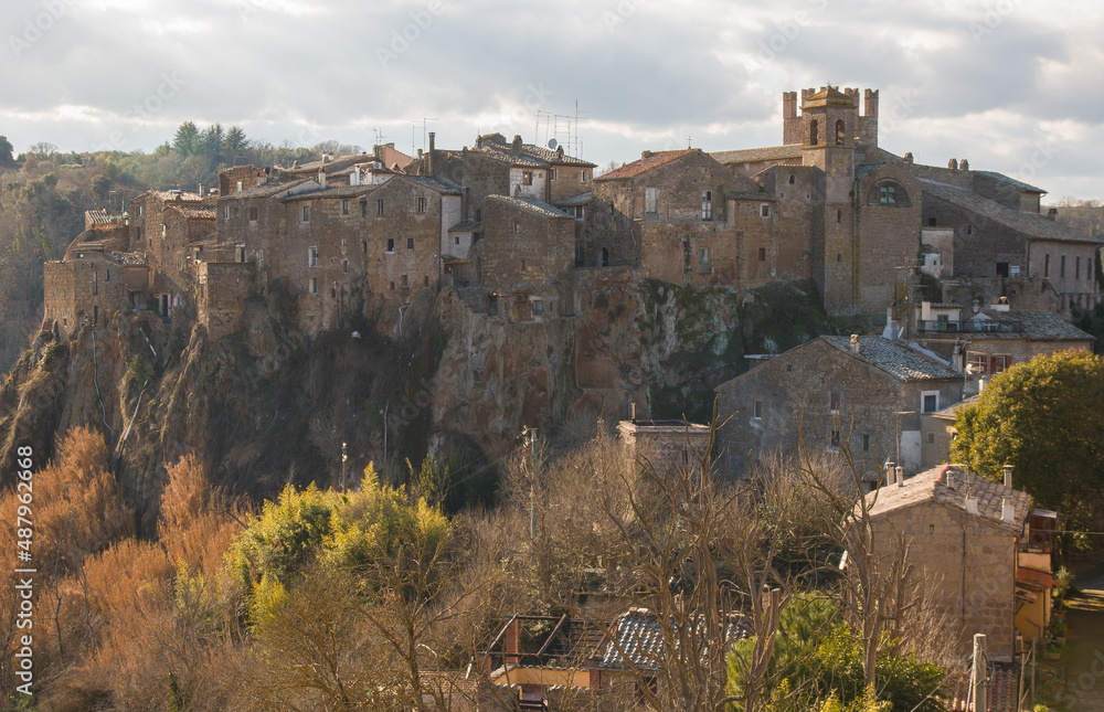 View of Calcata Vecchia, a small medieval town, in the steep volcanic cliff, near the Treja River in Lazio, Italy