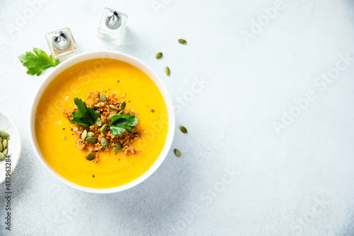 Traditional pumpkin soup with seeds and parsley