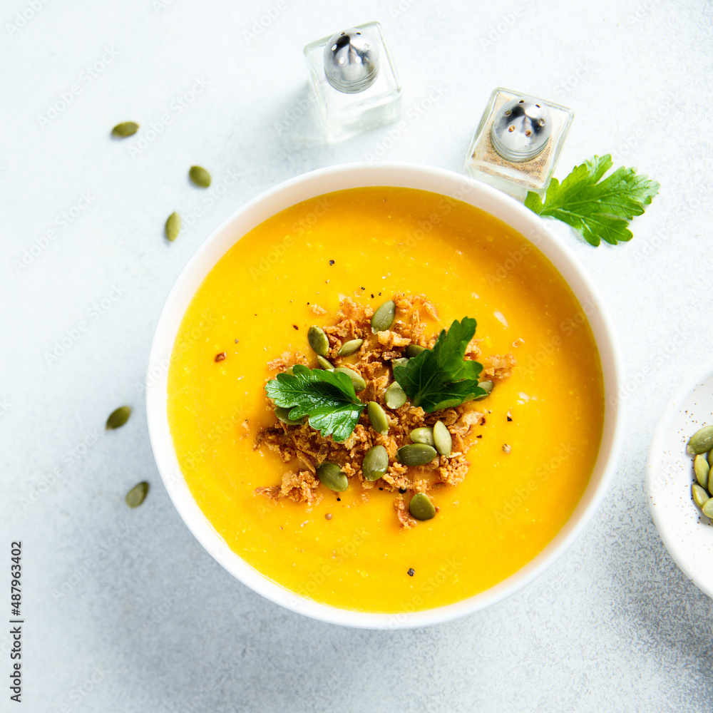 Traditional pumpkin soup with seeds and parsley Traditional pumpkin soup with seeds and parsley