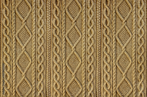 Obraz na plátne Beige background knitted fabric with a pattern