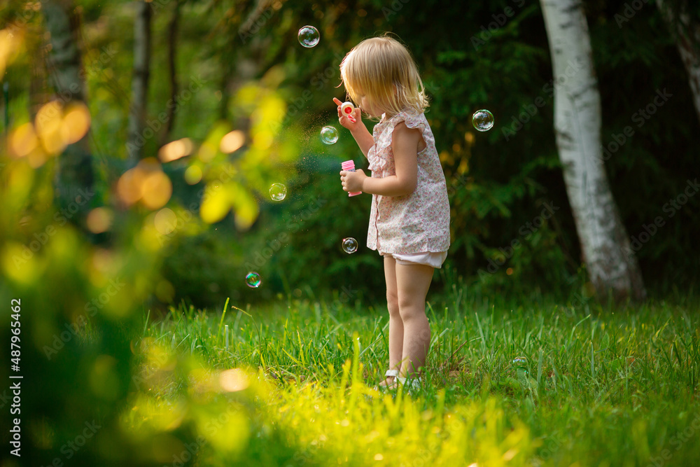 little child playing in the grass little child playing in the grass