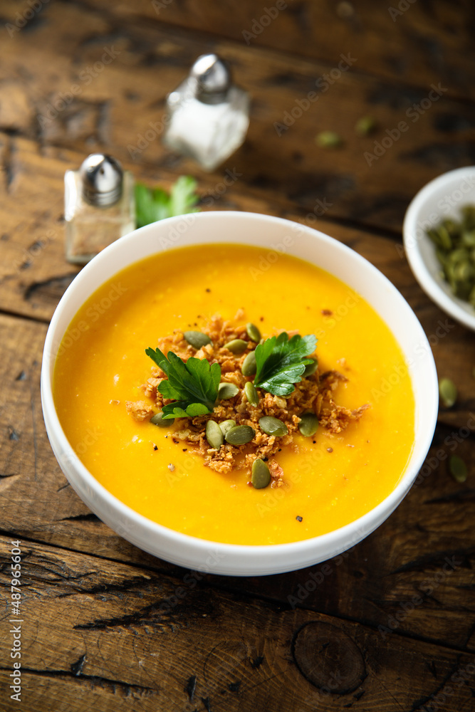 Traditional pumpkin soup with seeds and parsley Traditional pumpkin soup with seeds and parsley