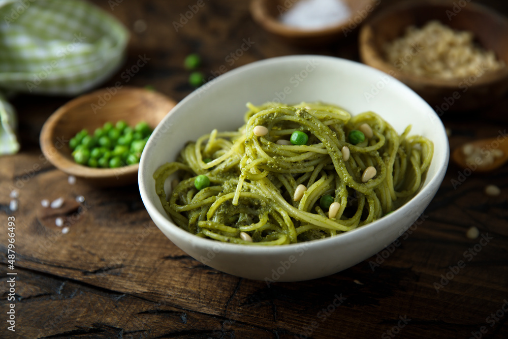 Spaghetti with pesto sauce and green pea Spaghetti with pesto sauce and green pea