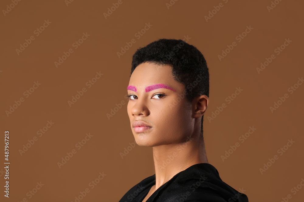 Fashionable young guy with unusual eyebrows on color background Fashionable young guy with unusual eyebrows on color background