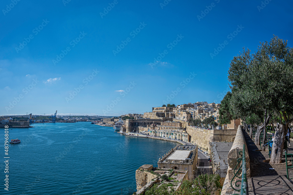 Panoramic view of city wall and harbor in Valletta, Malta.