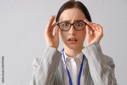 Worried young businesswoman...