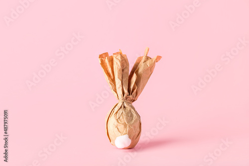 Egg wrapped in paper on col...