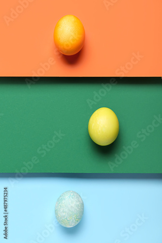 Easter eggs on color paper background