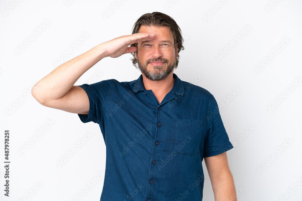Senior dutch man isolated on white background saluting with hand with happy expression Senior dutch man isolated on white background saluting with hand with happy expression