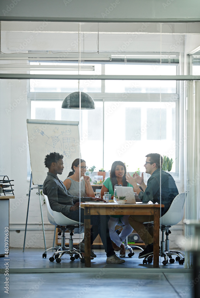 © Yuri A/peopleimages.com - Building ideas. Shot of a group of coworkers in a boardroom meeting.
