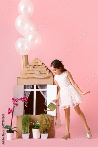 Funny little girl playing w...