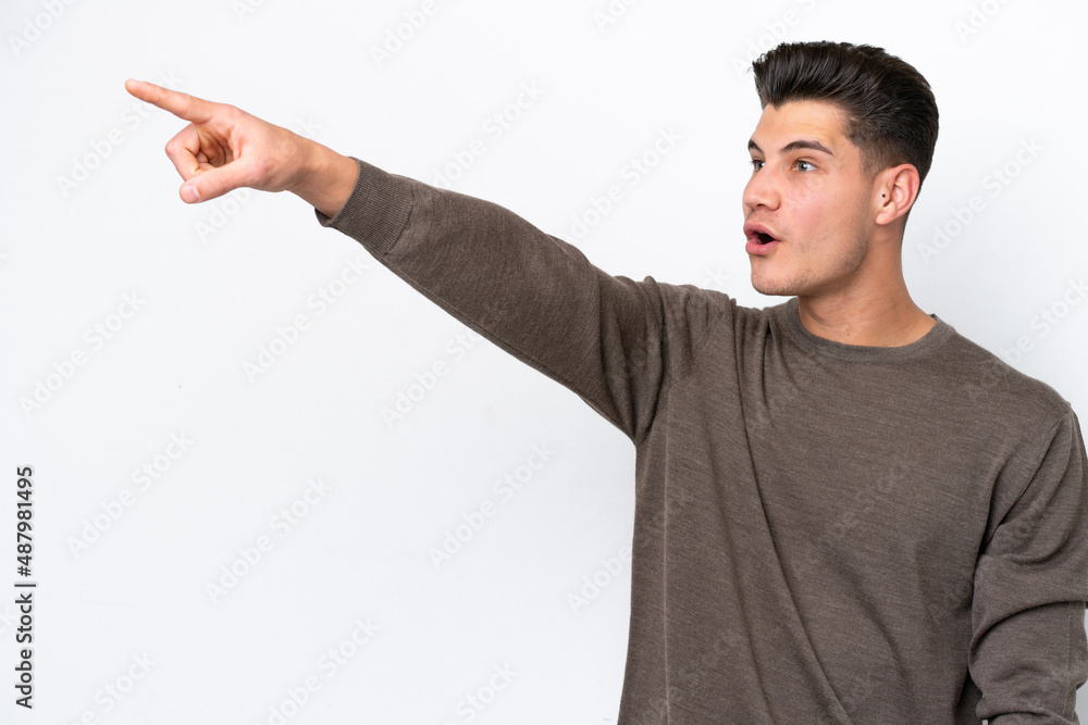 Young handsome caucasian man isolated on white bakcground pointing away Young handsome caucasian man isolated on white bakcground pointing away