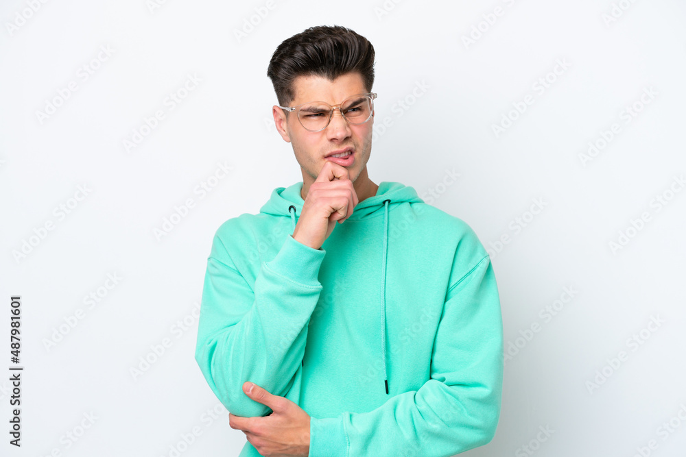 Young handsome caucasian man isolated on white bakcground having doubts and thinking Young handsome caucasian man isolated on white bakcground having doubts and thinking
