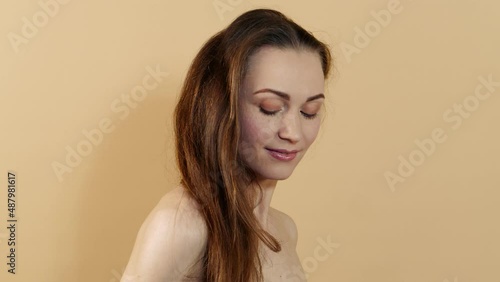 Wallpaper Mural Portrait of attractive happy caucasian girl with clean skin isolated on beige studio background. Skin care concept. Torontodigital.ca