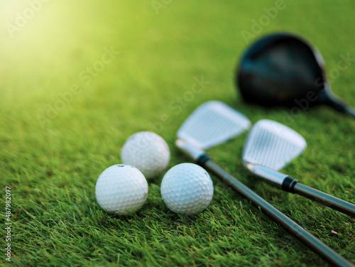 Different golf club on green grass background. sport concept.