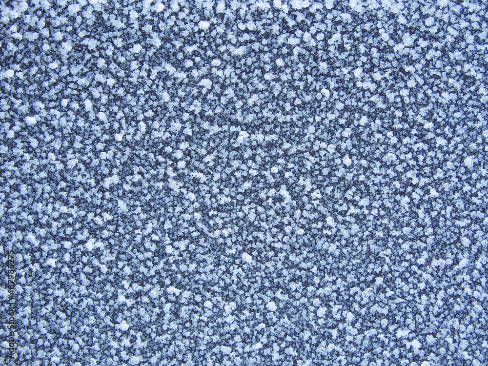 Blue frost texture on the surface. Winter background. Template for product display. Ice texture background. Frost, ice surface. Close up of decorative winter frozen pattern. Blue frost texture on the surface. Winter background. Template for product display. Ice texture background. Frost, ice surface. Close up of decorative winter frozen pattern.