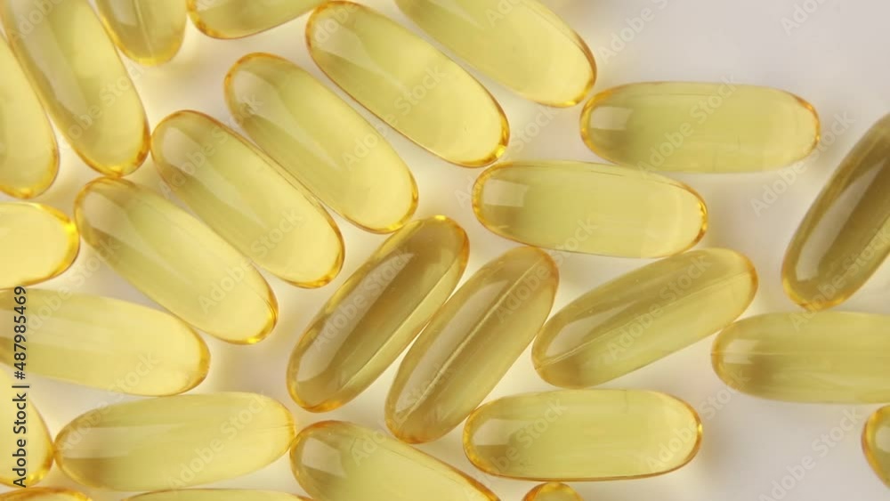 Rotation Closeup fish oil capsules Omega 3 isolated on white background, Health care concept, macro. Rotation Closeup fish oil capsules Omega 3 isolated on white background, Health care concept, macro.